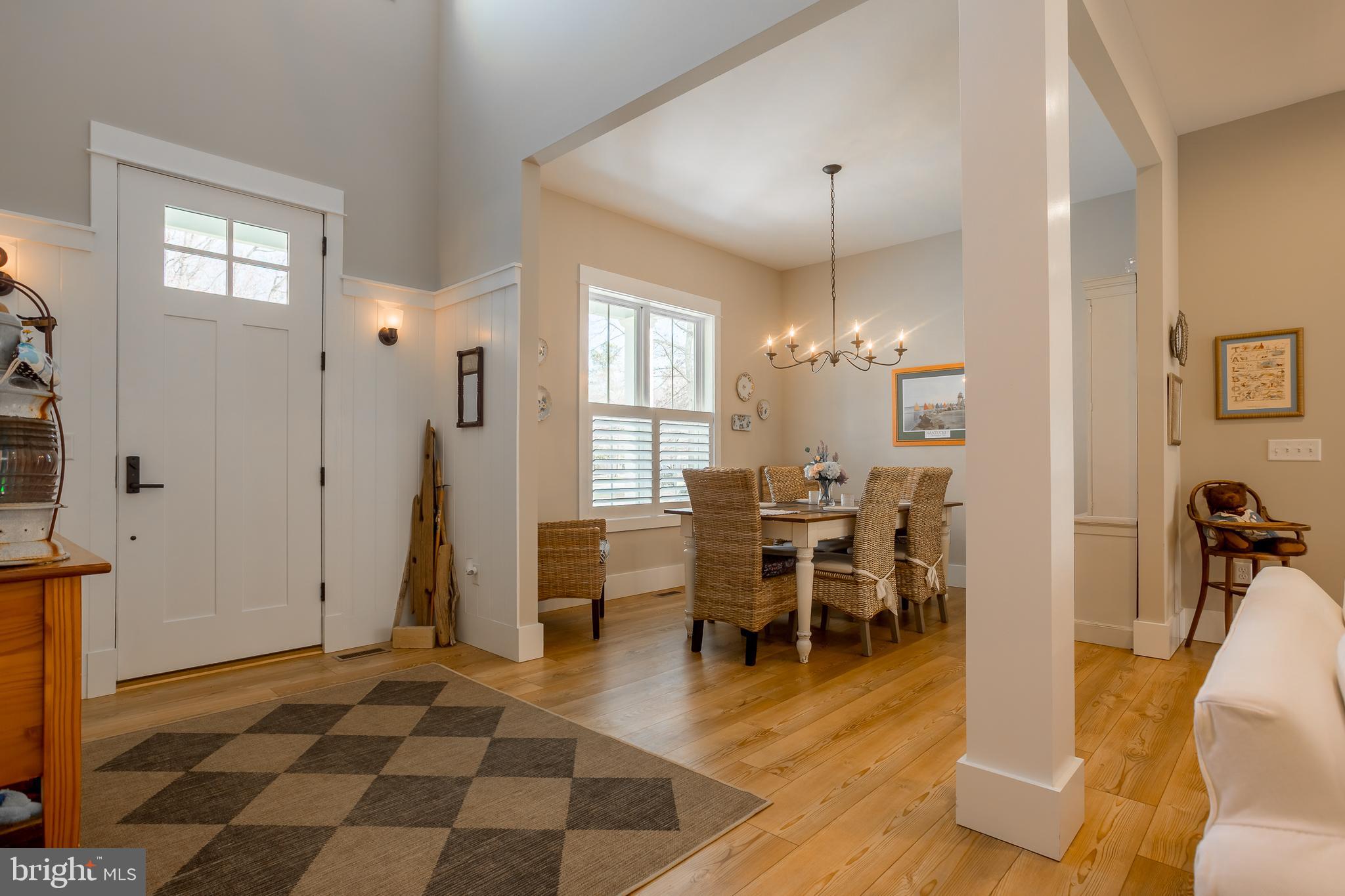 10 Haven Drive Georgetown, DE 19947 - Photo 17 of 76 a living room with furniture a dining table and a chandelier
