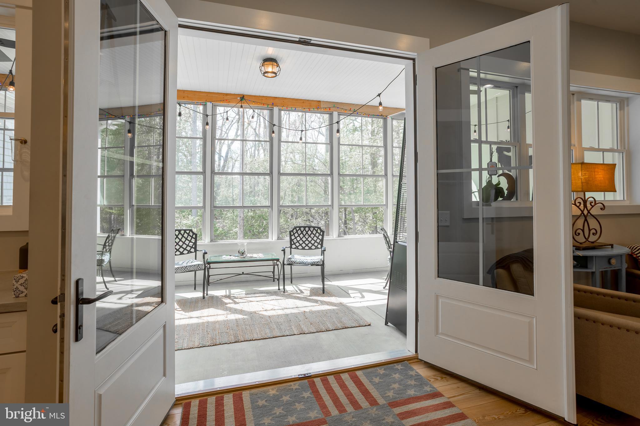 10 Haven Drive Georgetown, DE 19947 - Photo 31 of 76 a living room with furniture and a floor to ceiling window