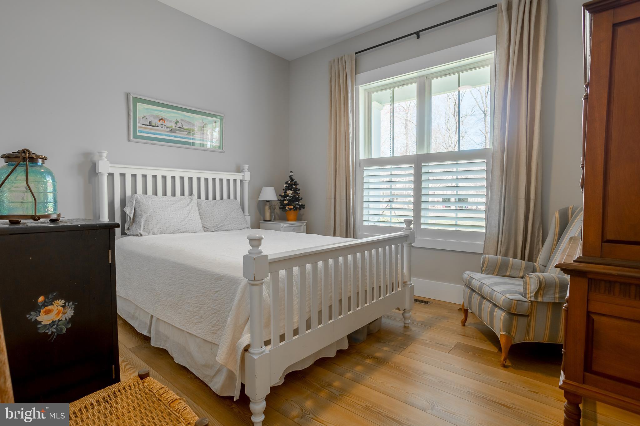 10 Haven Drive Georgetown, DE 19947 - Photo 36 of 76 a bed sitting in a bedroom next to a window