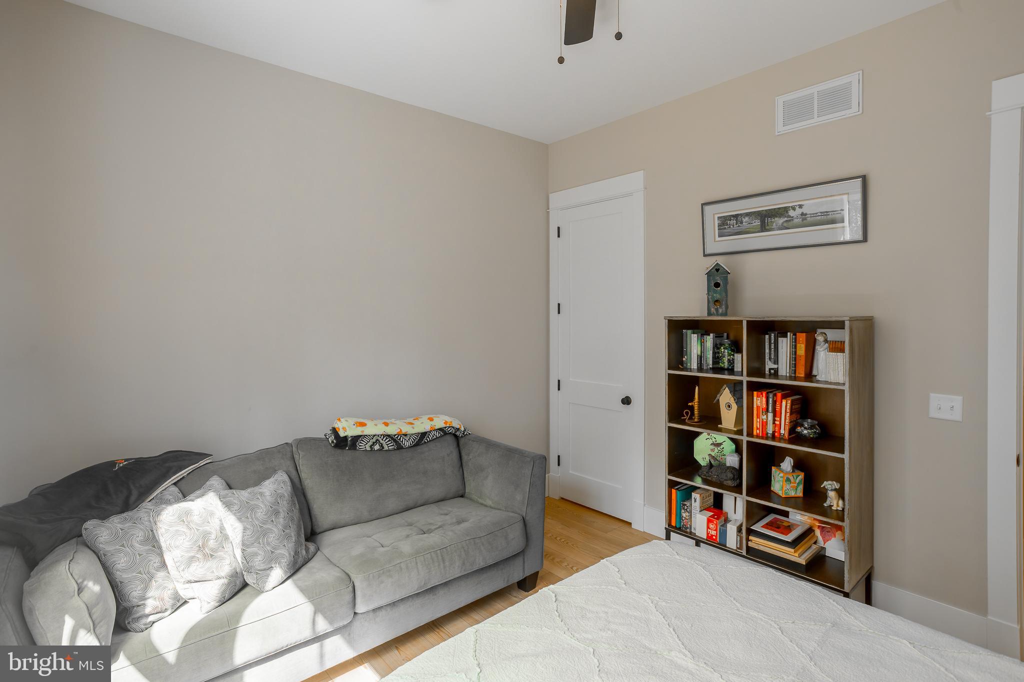 10 Haven Drive Georgetown, DE 19947 - Photo 41 of 76 a living room with furniture and a book shelf