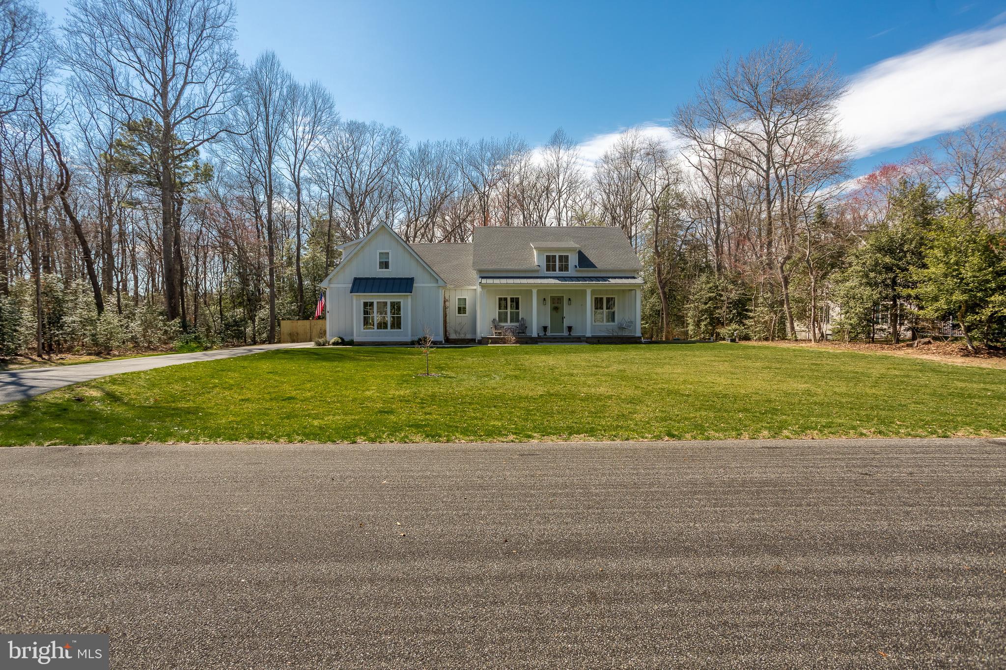 10 Haven Drive Georgetown, DE 19947 - Photo 7 of 76 a view of a big house with a big yard and large trees