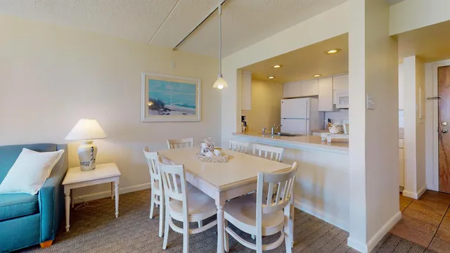 a dining room with a table and chairs