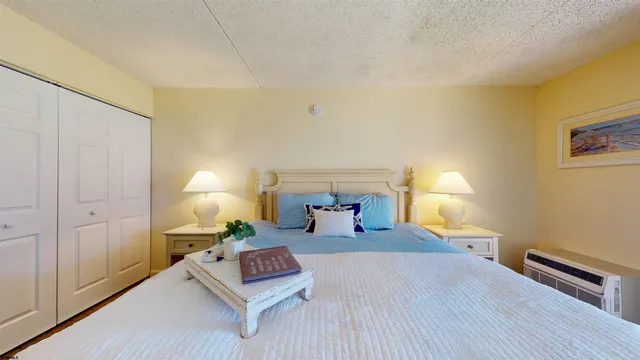 a living room with furniture and a lamp