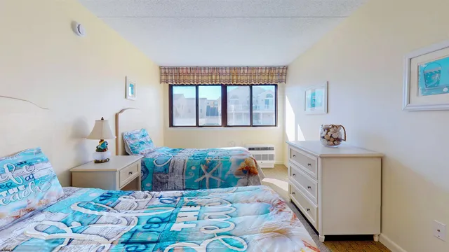 a bedroom with furniture and a window