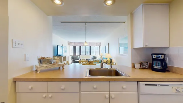 a kitchen with counter top space cabinets and stainless steel appliances