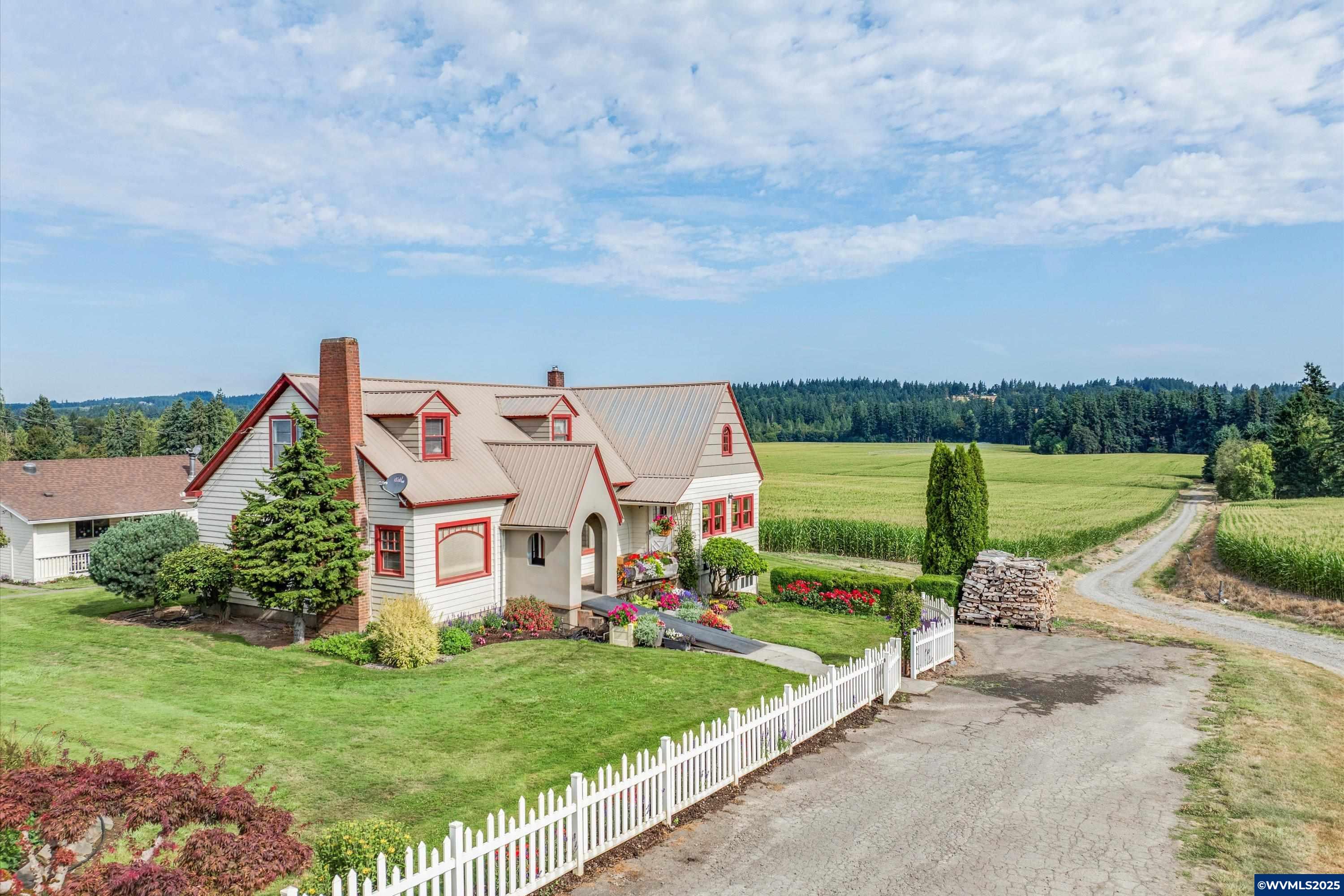 21303 South Central Point Road Canby, OR 97013 - Photo 2 of 50 an aerial view of a house with garden space and lake view in back