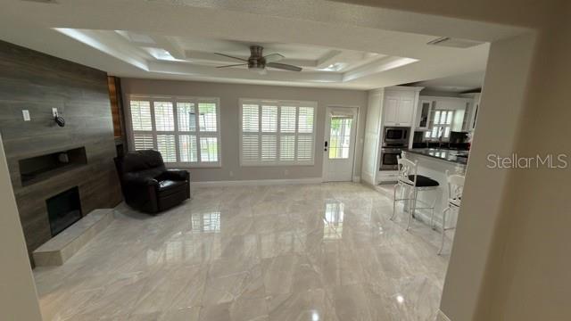 633 Spring Oaks Boulevard Altamonte Springs, FL 32714 - Photo 13 of 37 a living room with furniture and a fireplace