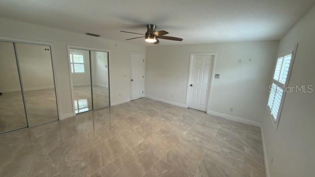 633 Spring Oaks Boulevard Altamonte Springs, FL 32714 - Photo 16 of 37 an empty room with fan and entrance