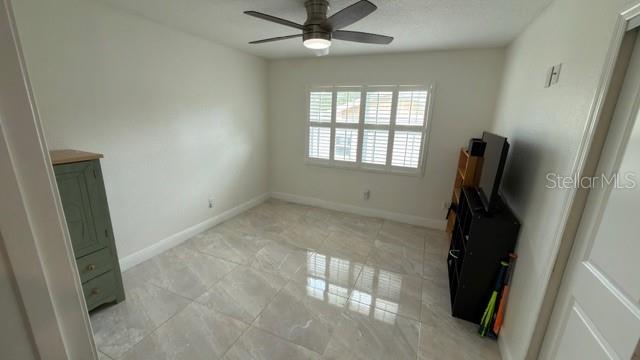 633 Spring Oaks Boulevard Altamonte Springs, FL 32714 - Photo 23 of 37 a view of a livingroom with a ceiling fan and window