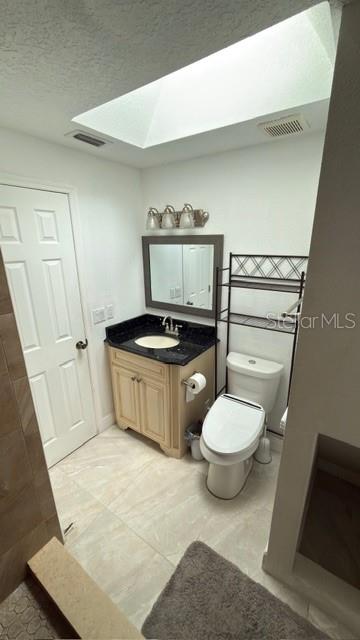 633 Spring Oaks Boulevard Altamonte Springs, FL 32714 - Photo 27 of 37 a bathroom with a sink a toilet and a mirror