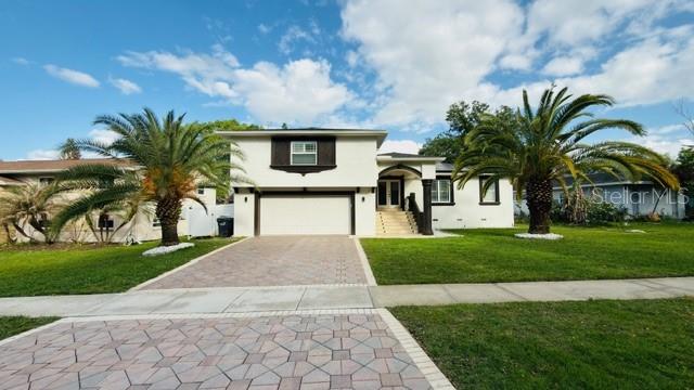 633 Spring Oaks Boulevard Altamonte Springs, FL 32714 - Photo 35 of 37 a view of a house with a yard