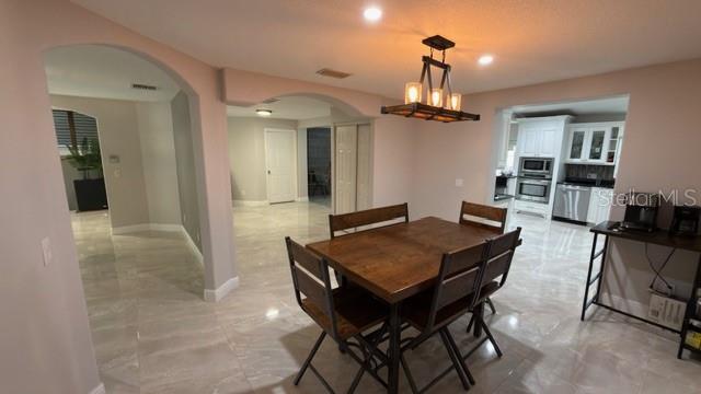 633 Spring Oaks Boulevard Altamonte Springs, FL 32714 - Photo 7 of 37 a view of a livingroom and dining room