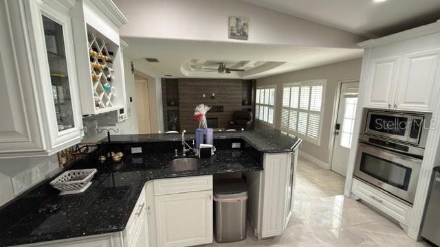 633 Spring Oaks Boulevard Altamonte Springs, FL 32714 - Photo 8 of 37 a kitchen with sink refrigerator and stove