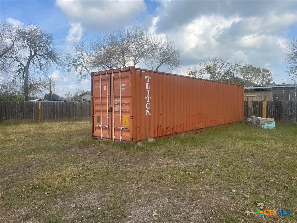 327 West Main Street Port Lavaca, TX 77979 - Photo 2 of 11 a backyard of a house with lots of green space and fog