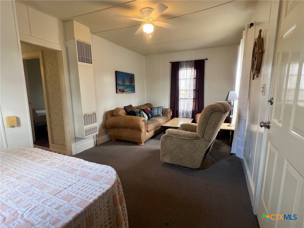 327 West Main Street Port Lavaca, TX 77979 - Photo 8 of 11 a bedroom with furniture and a window