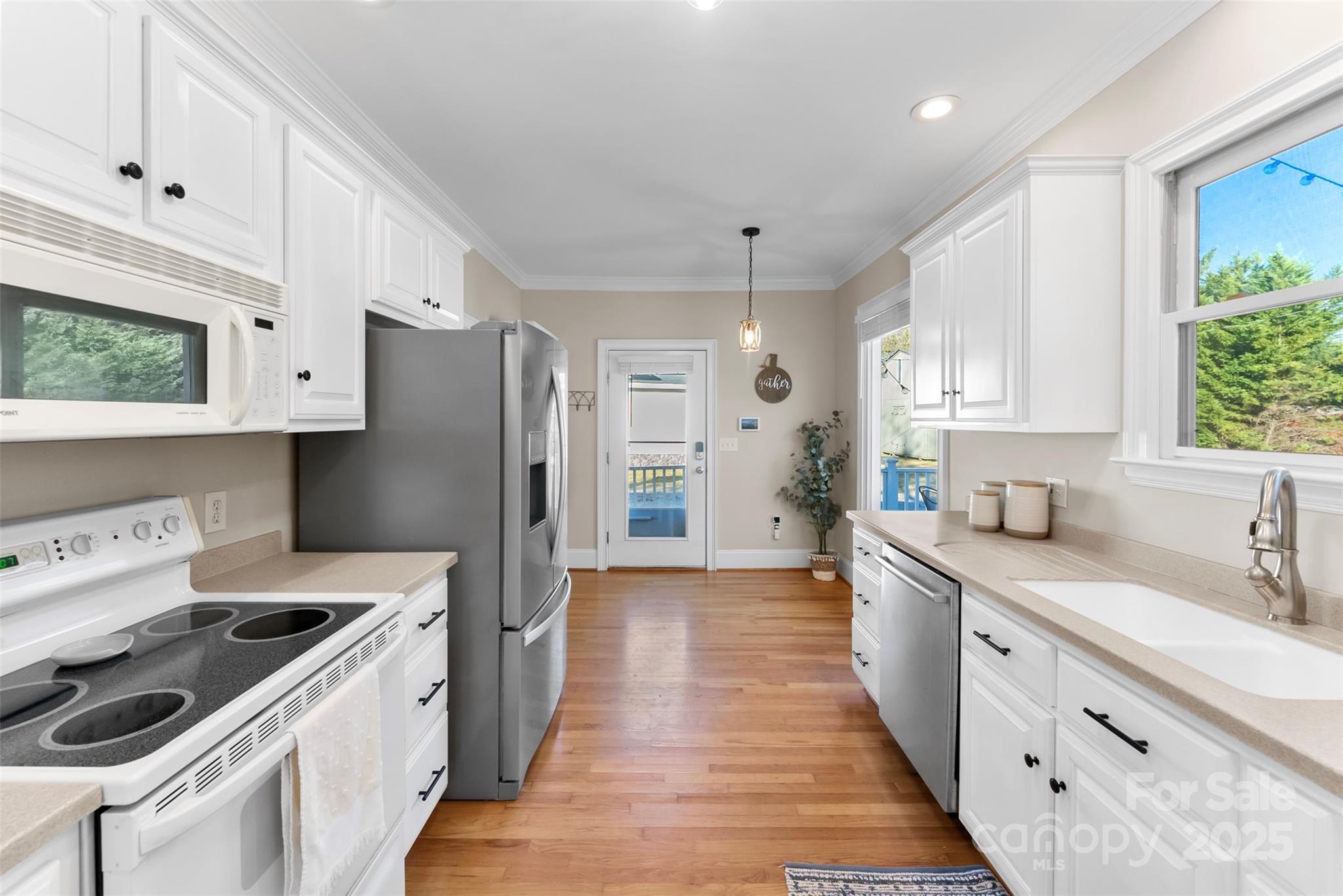 909 South Main Street Clover, SC 29710 - Photo 12 of 26 a kitchen with stainless steel appliances a stove a sink and a refrigerator