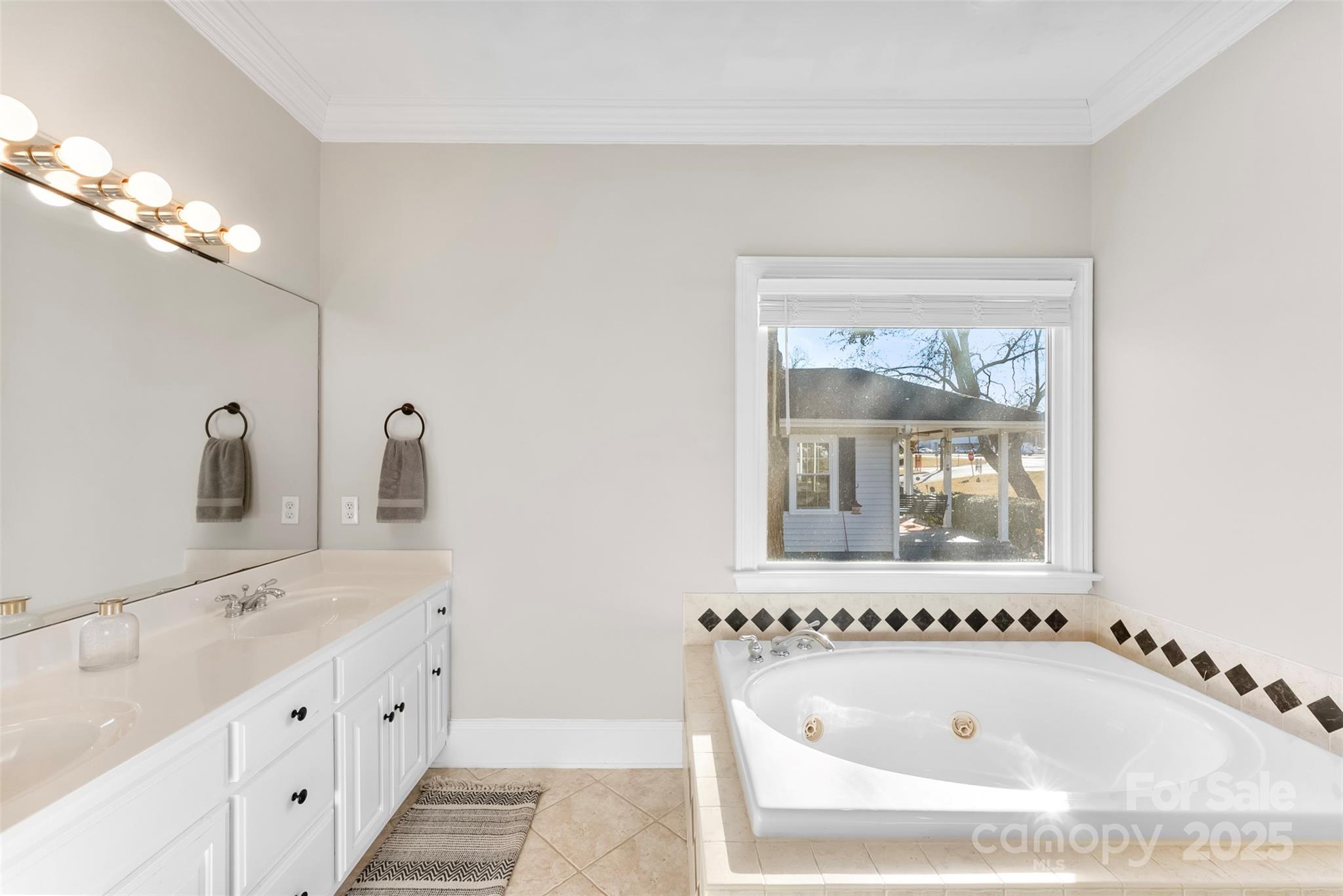 909 South Main Street Clover, SC 29710 - Photo 17 of 26 a bathroom with a tub sink and mirror