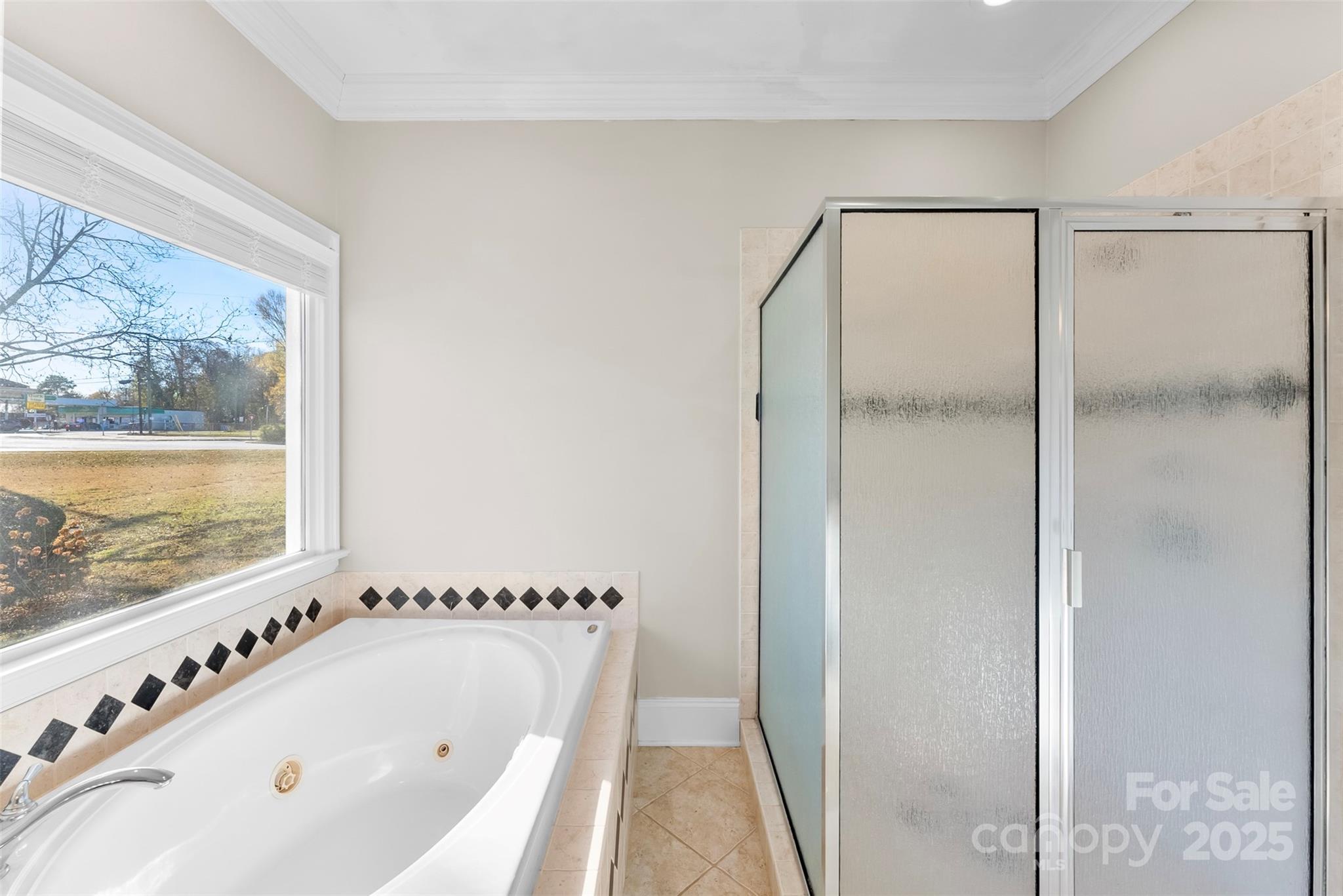 909 South Main Street Clover, SC 29710 - Photo 19 of 26 a bathroom with bathtub and window
