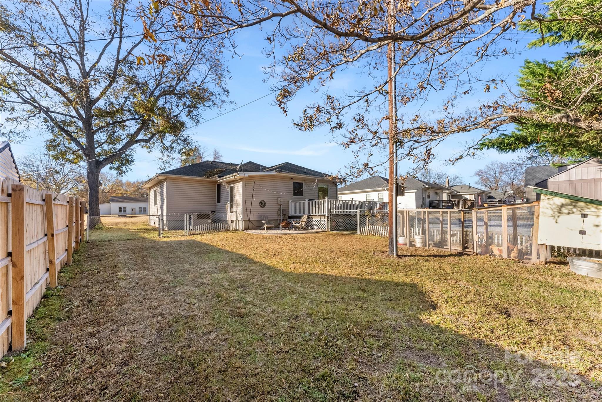909 South Main Street Clover, SC 29710 - Photo 25 of 26 a yellow house with trees in front of it