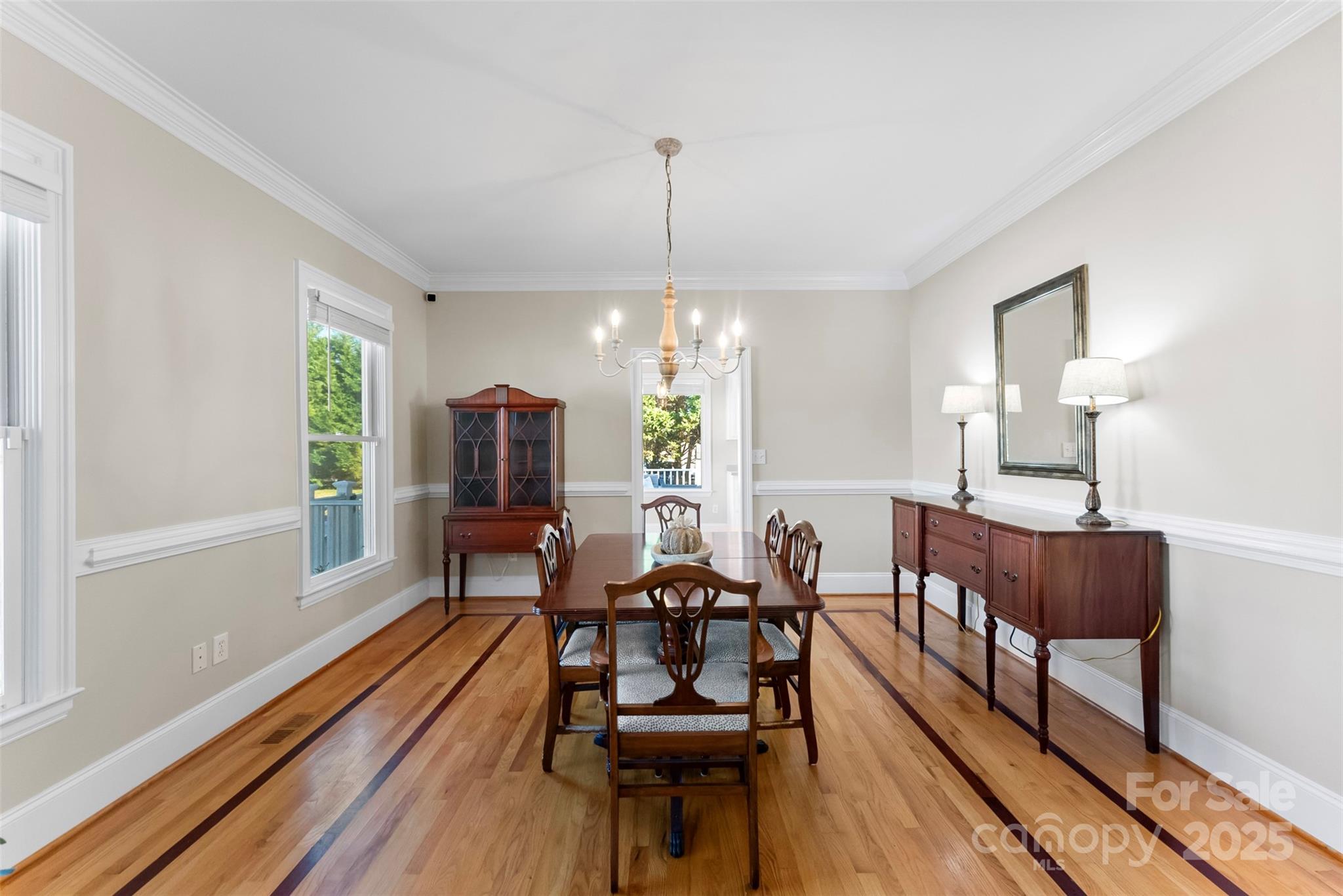 909 South Main Street Clover, SC 29710 - Photo 6 of 26 a dining room with furniture a chandelier and wooden floor