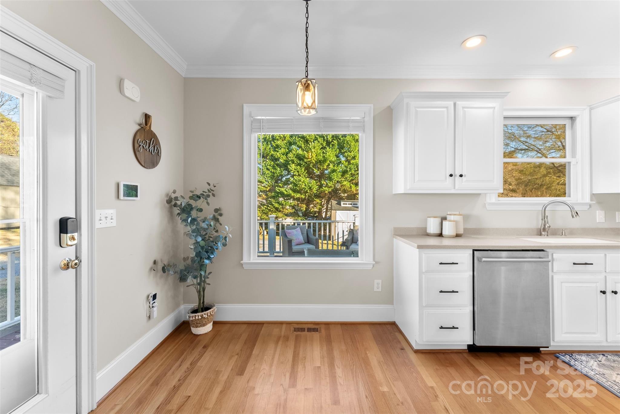 909 South Main Street Clover, SC 29710 - Photo 8 of 26 a kitchen with white cabinets and window
