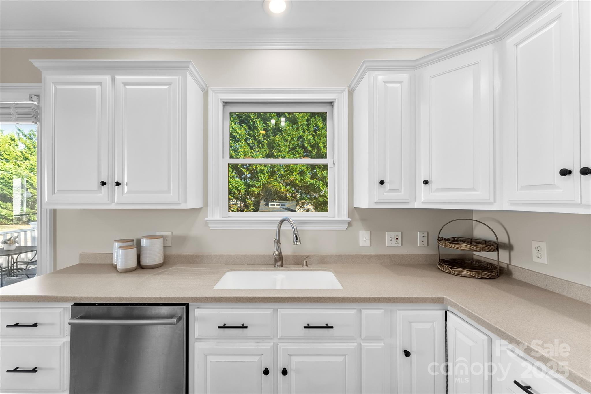 909 South Main Street Clover, SC 29710 - Photo 10 of 26 a kitchen with stainless steel appliances a sink a window and cabinets