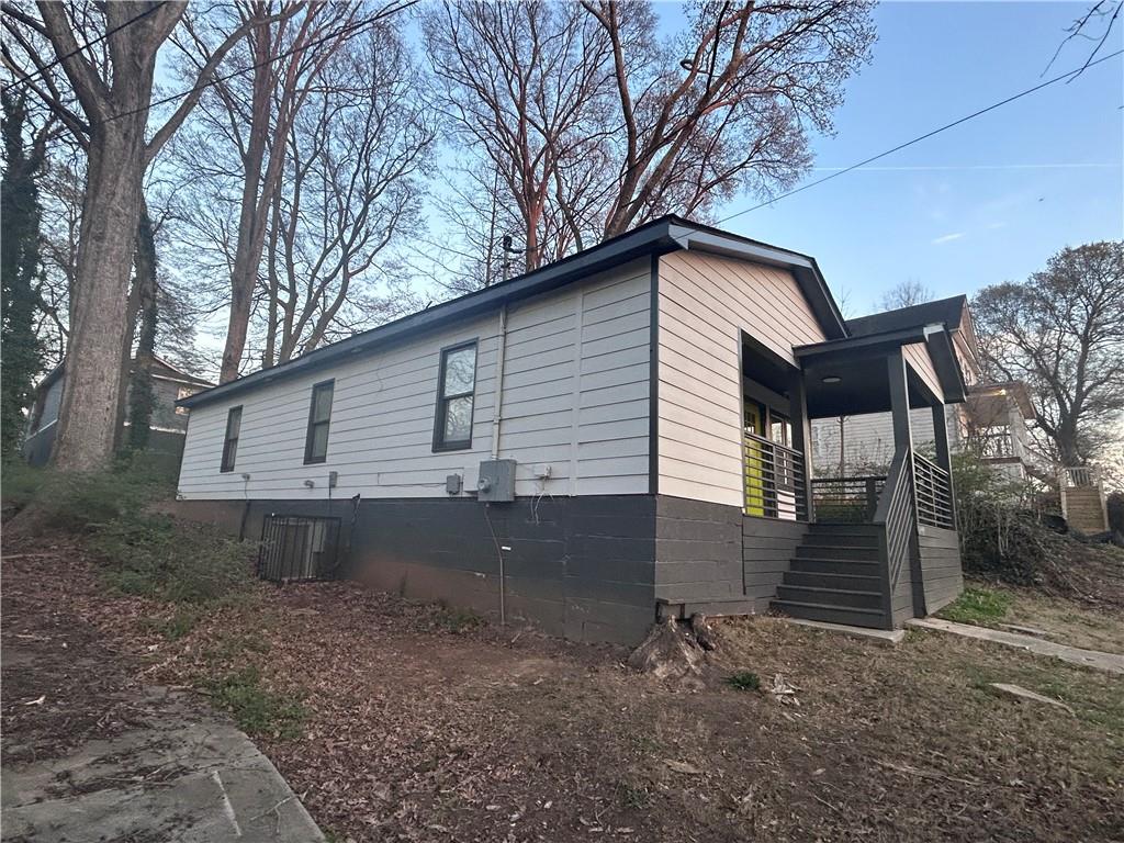 1170 Booker Avenue Southwest Atlanta, GA 30310 - Photo 3 of 3 a front view of a house with garden