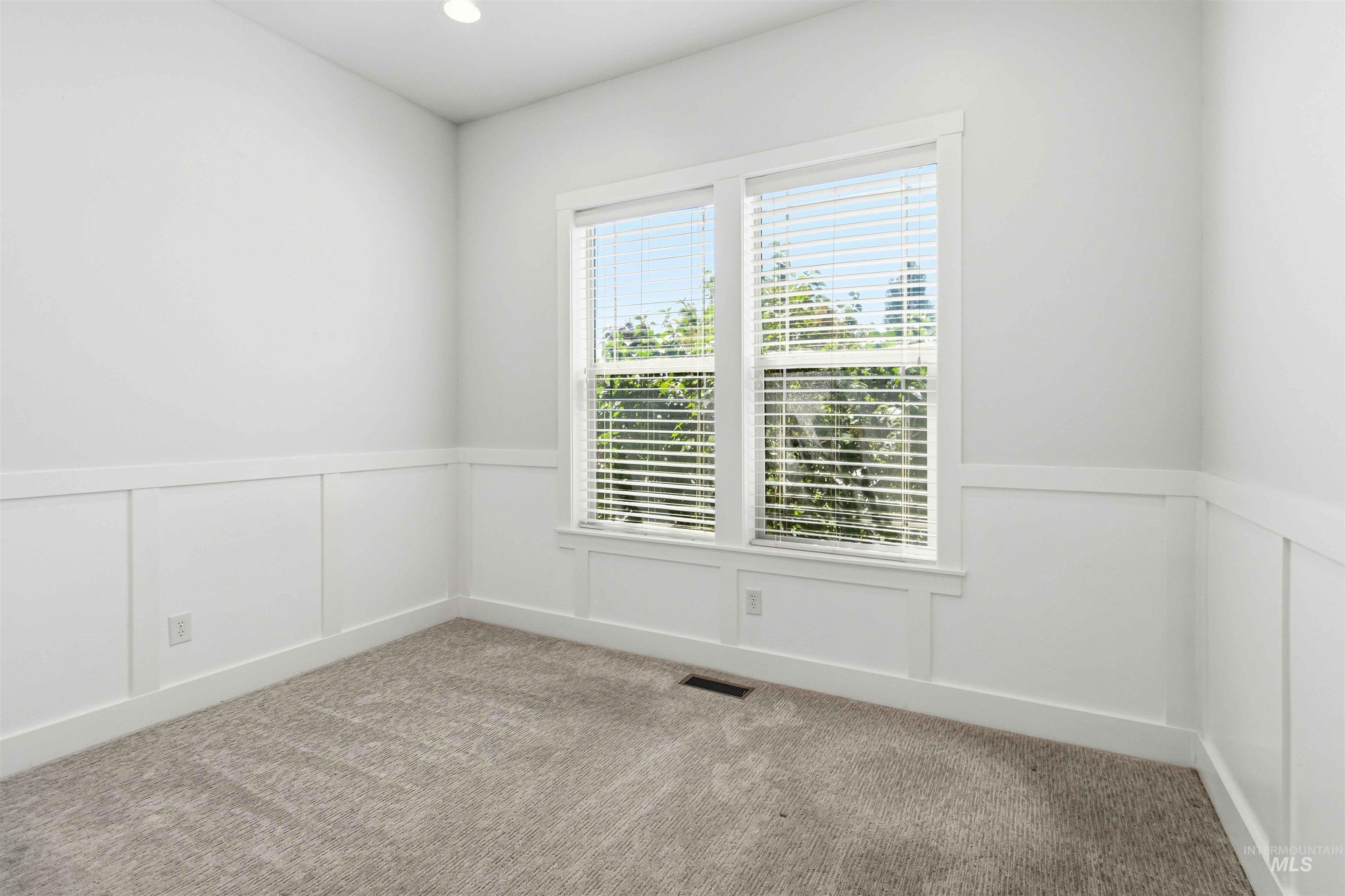 3218 North Cherry Laurel Way Star, ID 83669 - Photo 28 of 50 Built-in soaking tub with tile surround, decorative mosaic tile accent, and transom window