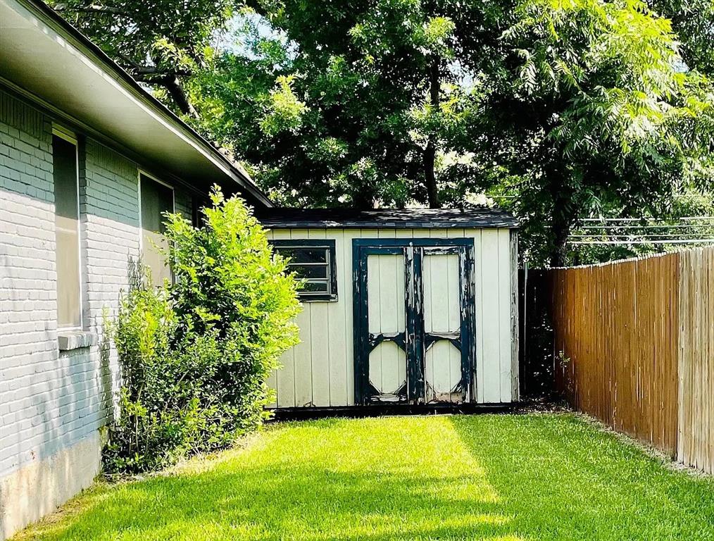 3152 Walnut Hill Lane Dallas, TX 75229 - Photo 16 of 18 a backyard of a house with garden