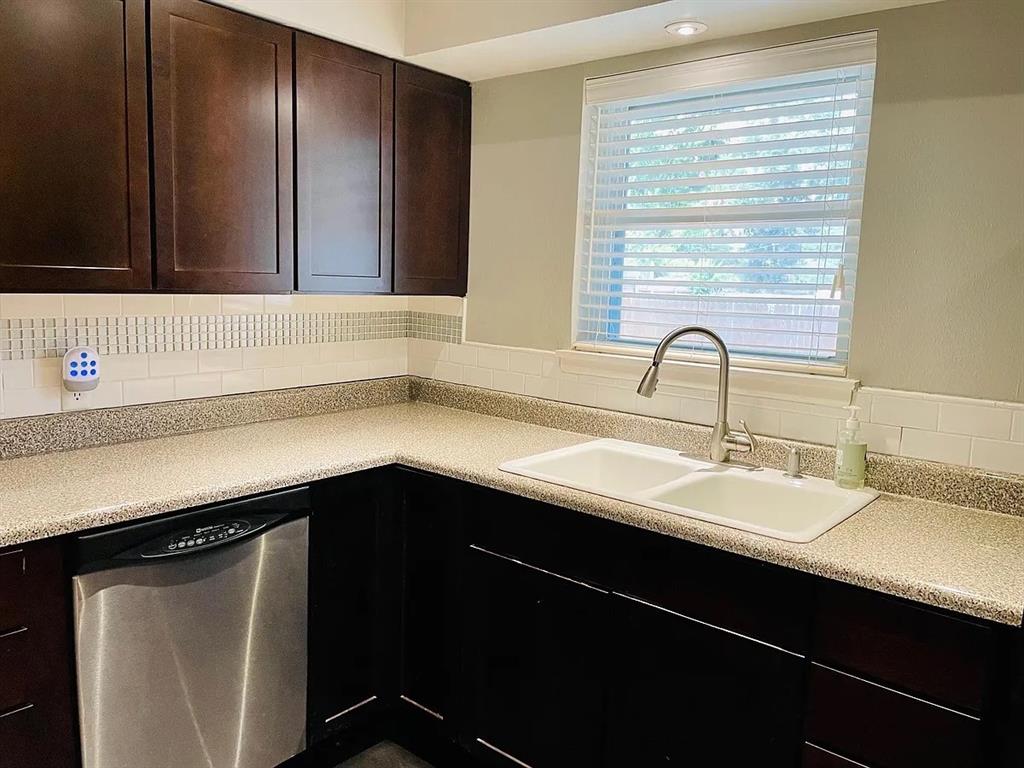 3152 Walnut Hill Lane Dallas, TX 75229 - Photo 4 of 18 a kitchen with a sink and a window