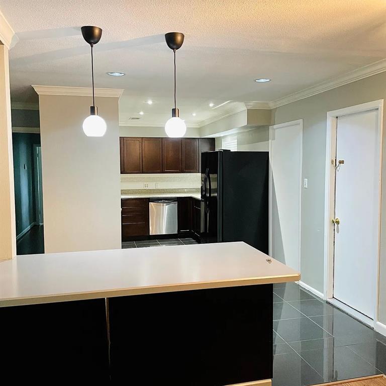 3152 Walnut Hill Lane Dallas, TX 75229 - Photo 5 of 18 a kitchen with cabinets and stainless steel appliances