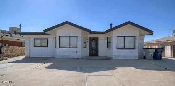 a front view of a house with yard