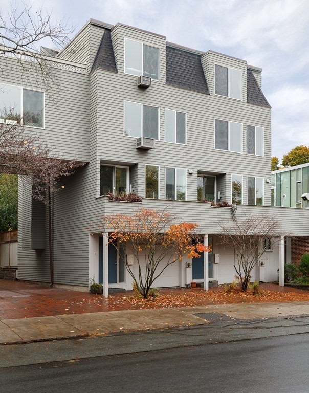 a front view of a house with a road