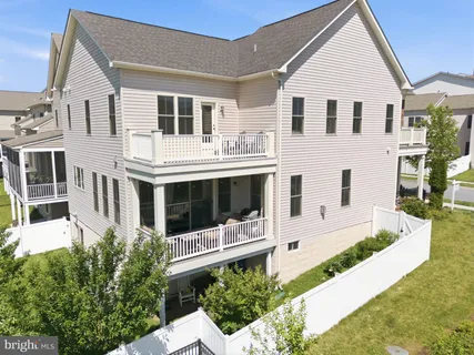 a front view of a house with a yard outdoor seating and barbeque oven