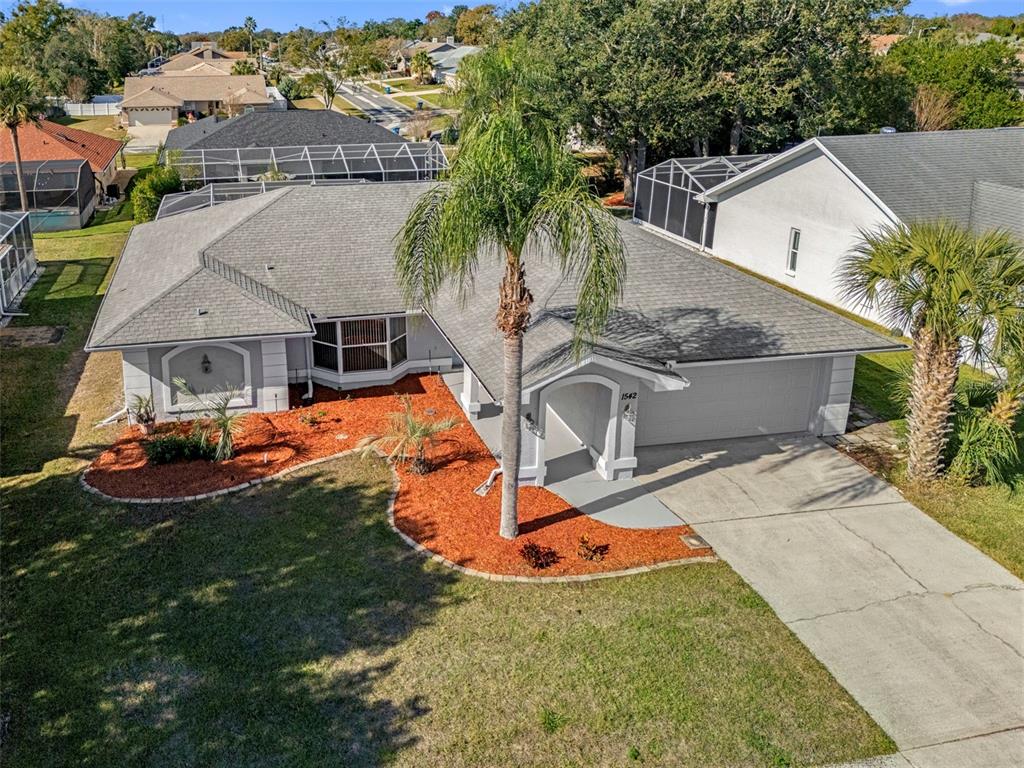 1542 Overland Drive Spring Hill, FL 34608 - Photo 3 of 58 an aerial view of a house with swimming pool garden and patio