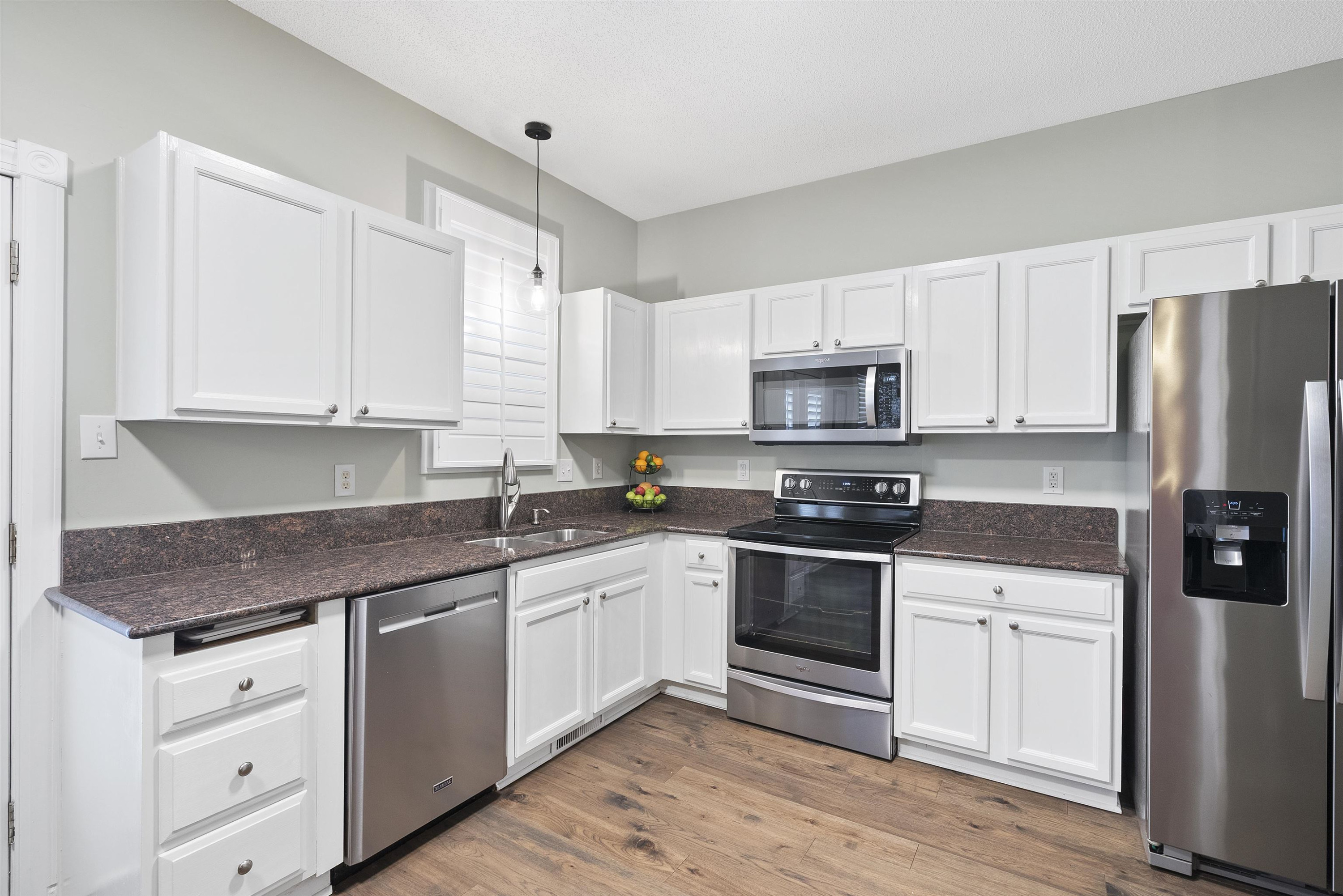 408 Chancellors Ridge Drive Durham, NC 27713 - Photo 11 of 34 a kitchen with stainless steel appliances granite countertop a stove a sink and a refrigerator