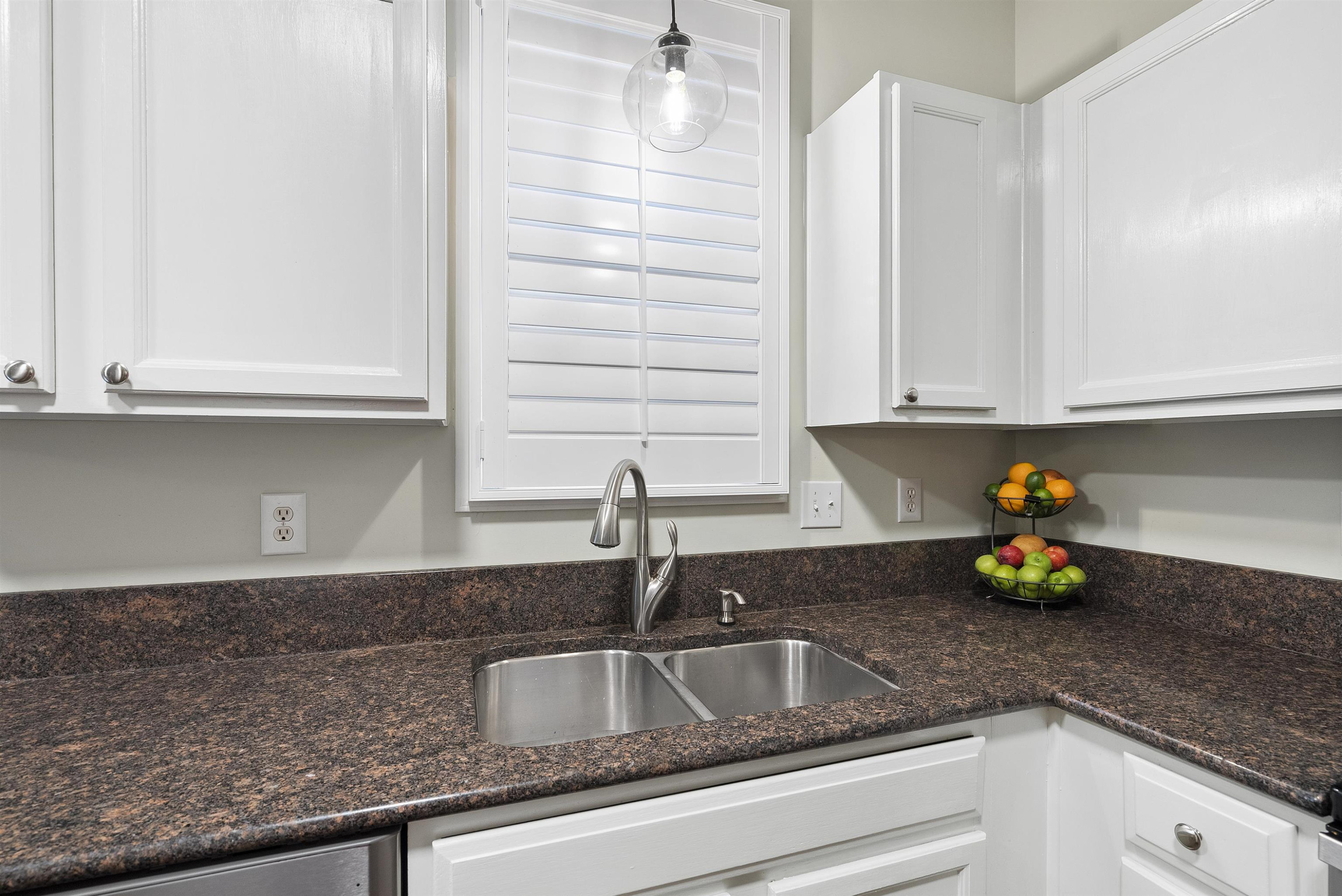 408 Chancellors Ridge Drive Durham, NC 27713 - Photo 12 of 34 a kitchen with granite countertop a sink and cabinets