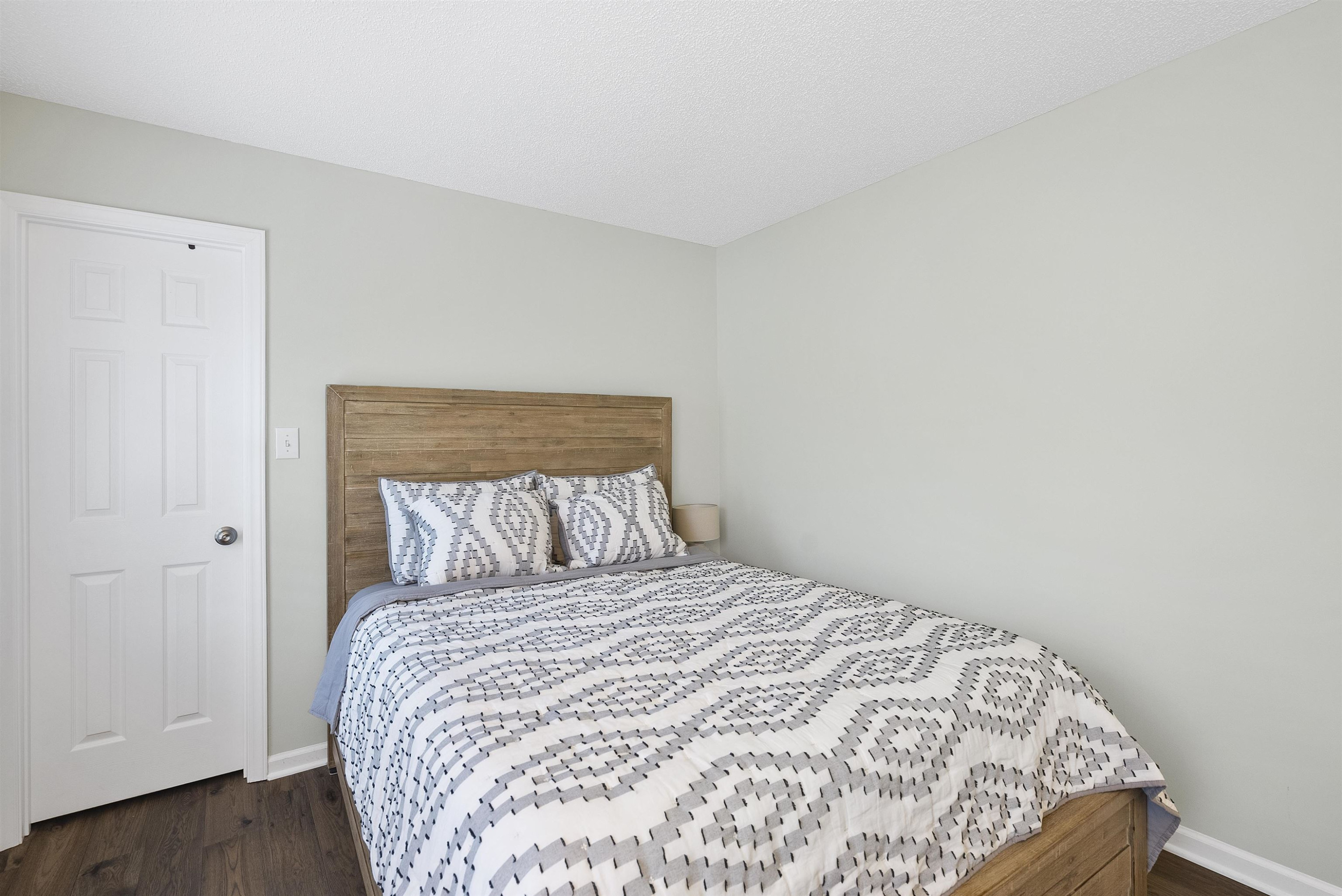 408 Chancellors Ridge Drive Durham, NC 27713 - Photo 18 of 34 a bed sitting in a bedroom next to a bathroom