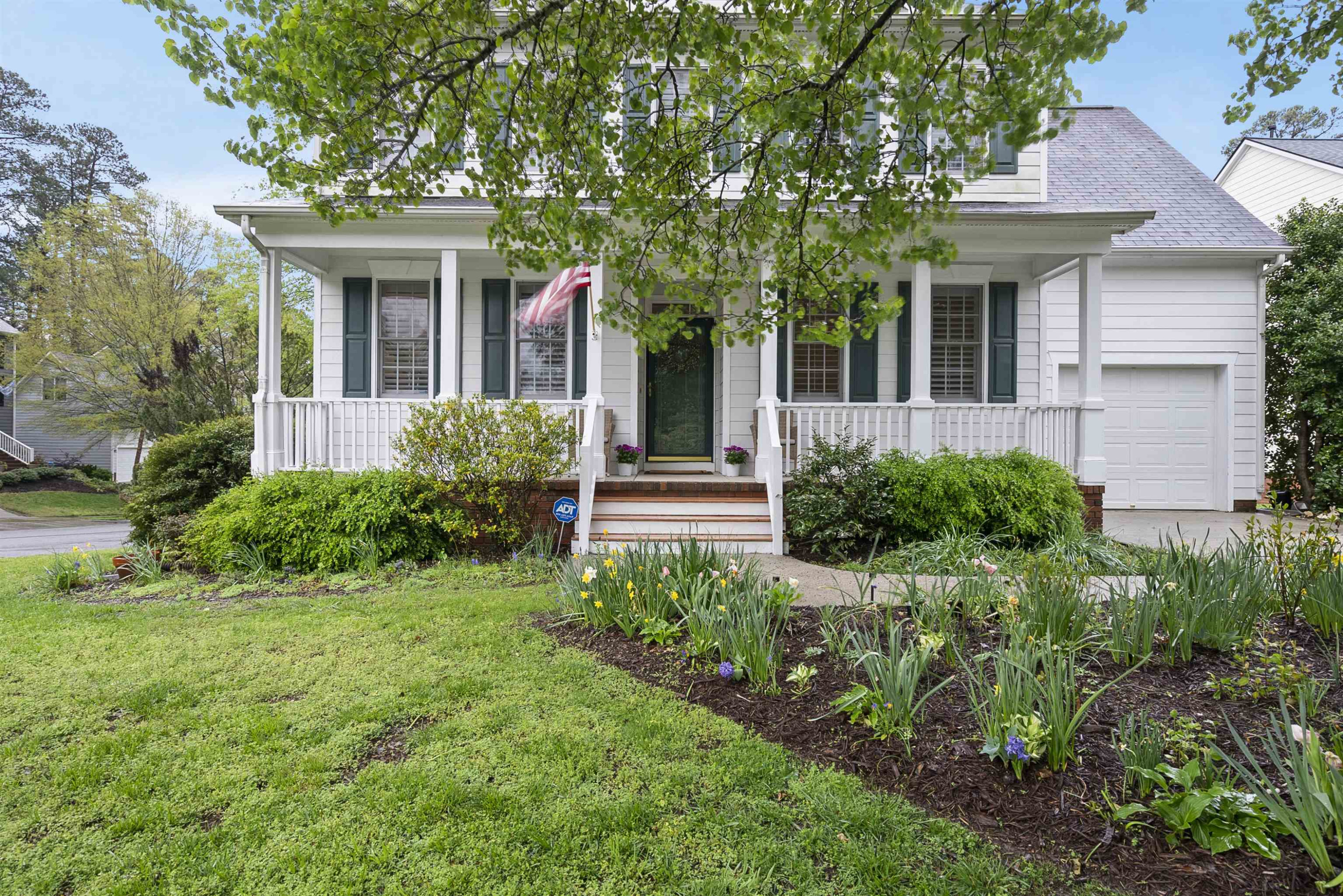 408 Chancellors Ridge Drive Durham, NC 27713 - Photo 2 of 34 a front view of a house with a yard