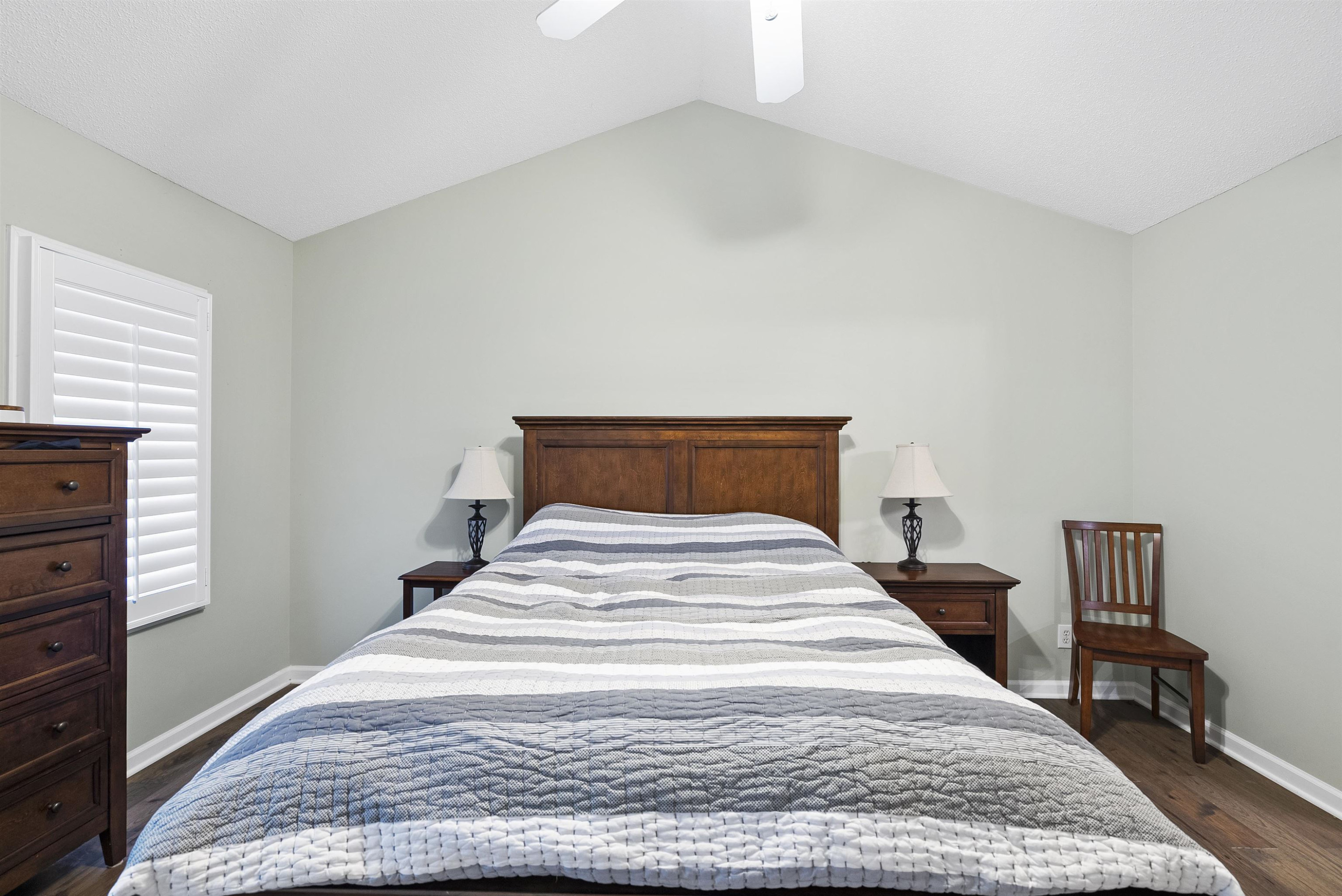 408 Chancellors Ridge Drive Durham, NC 27713 - Photo 23 of 34 a bedroom with a bed and wooden floor