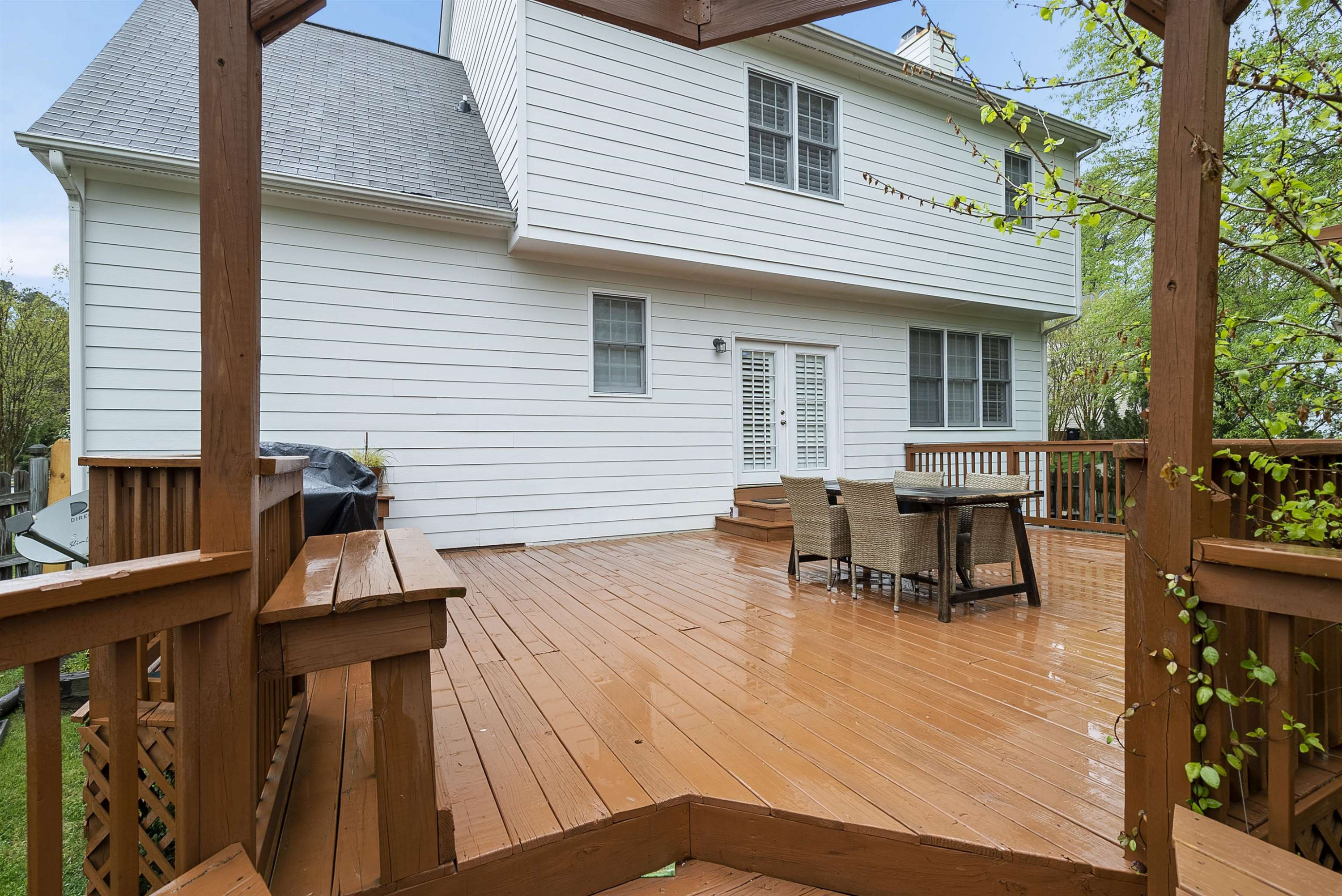 408 Chancellors Ridge Drive Durham, NC 27713 - Photo 31 of 34 a view of a patio with table and chairs with wooden floor and fence