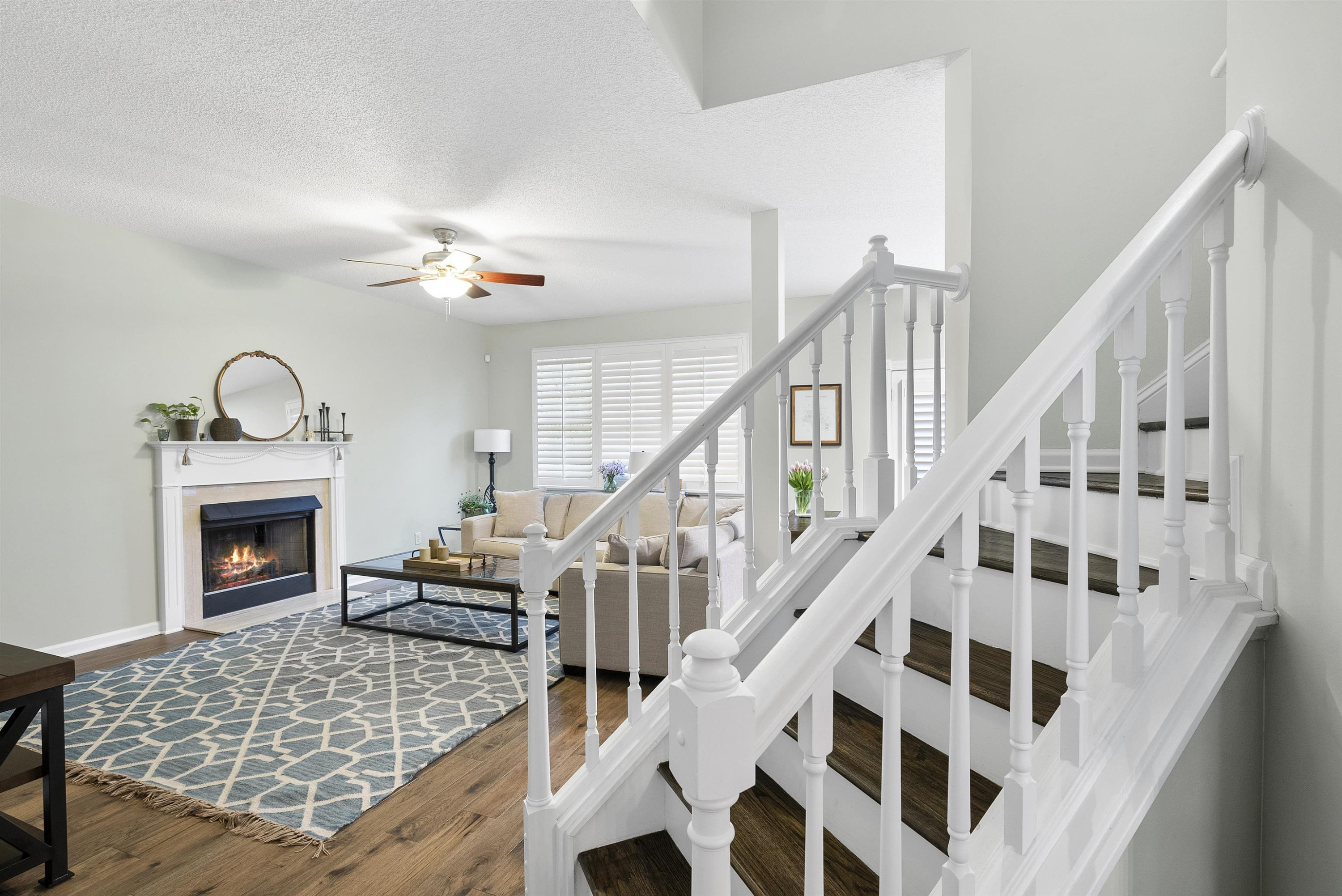 408 Chancellors Ridge Drive Durham, NC 27713 - Photo 4 of 34 a living room with wooden floor and a fireplace