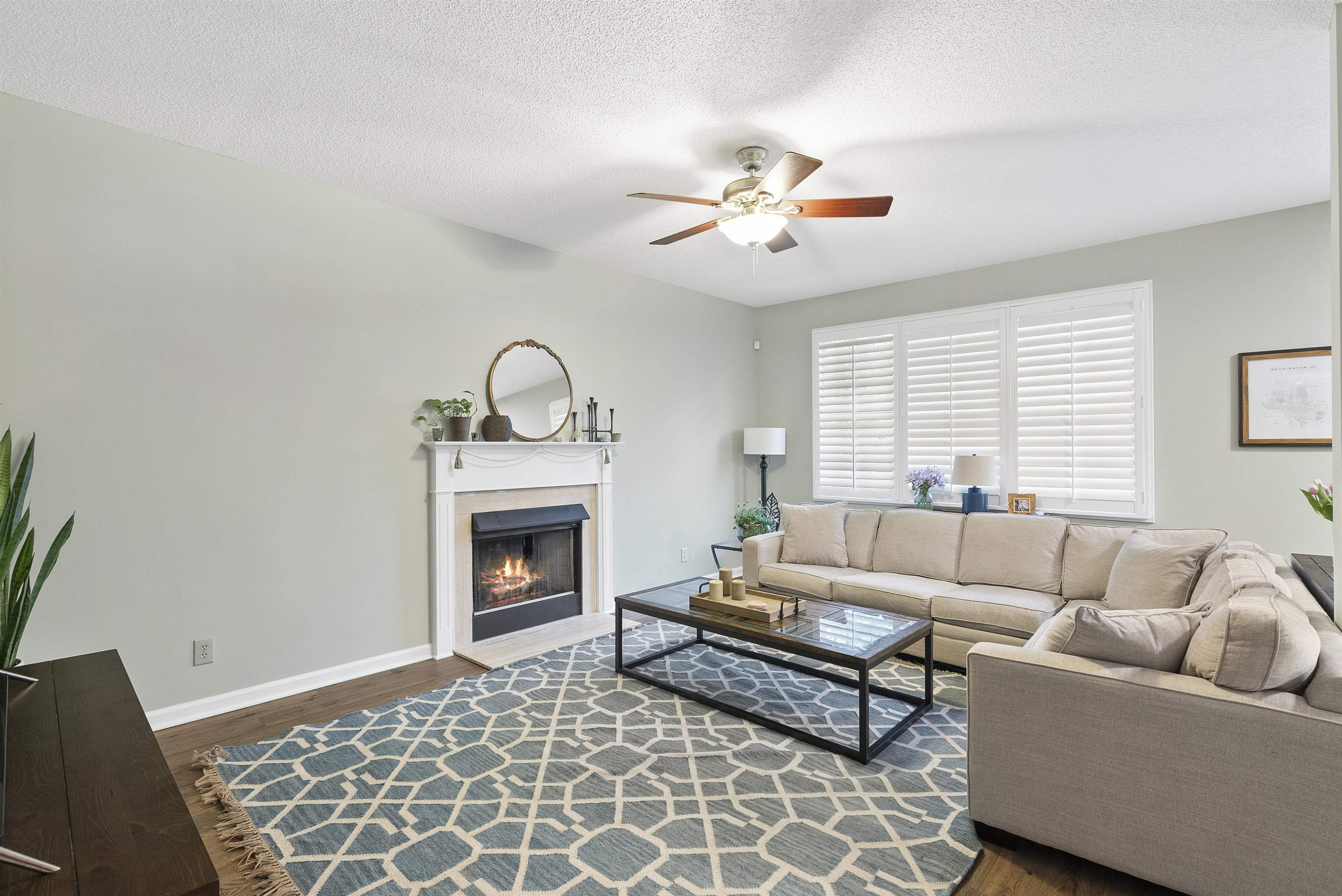 408 Chancellors Ridge Drive Durham, NC 27713 - Photo 7 of 34 a living room with furniture a fireplace and a window