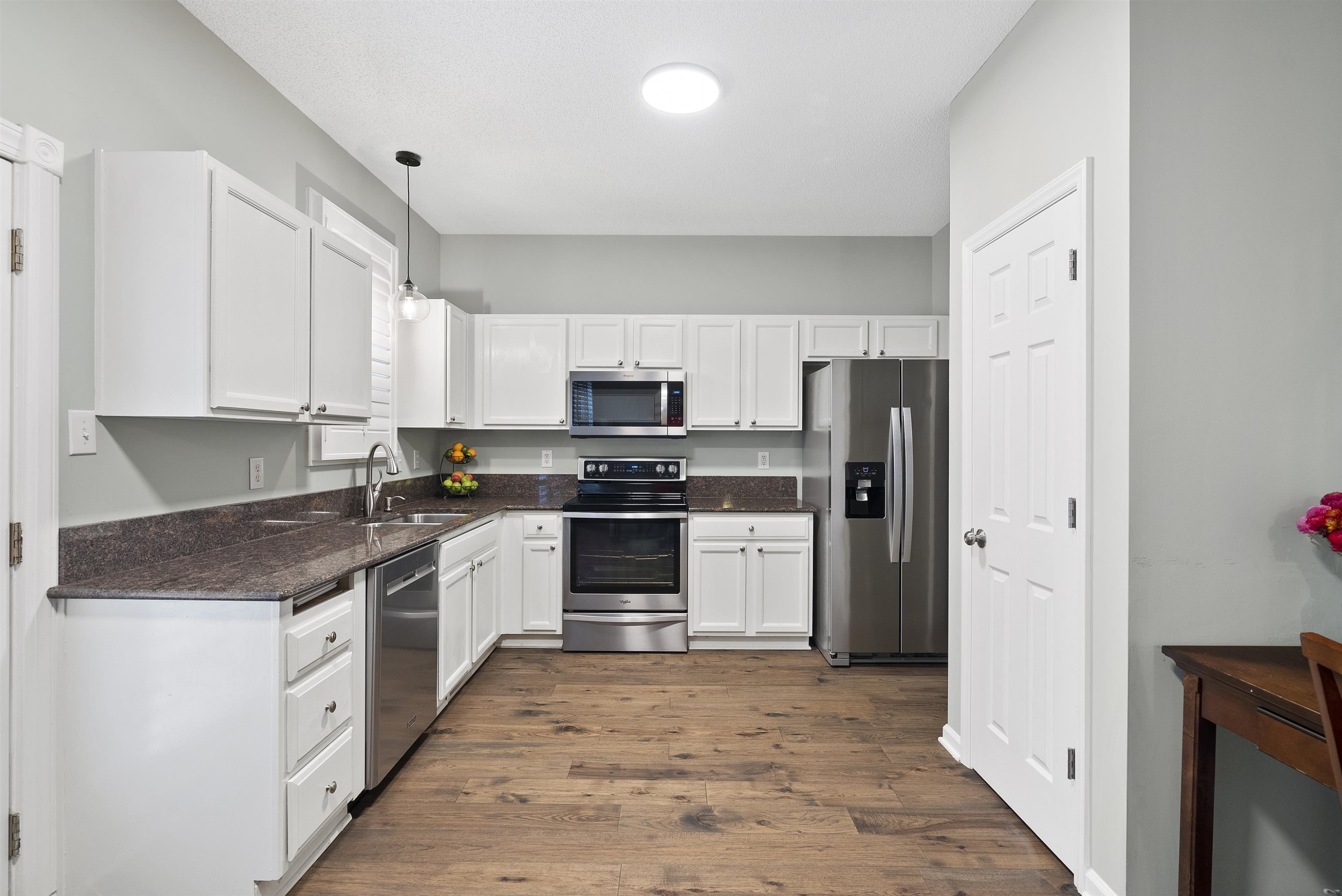 408 Chancellors Ridge Drive Durham, NC 27713 - Photo 10 of 34 a kitchen with stainless steel appliances granite countertop a refrigerator and a stove top oven
