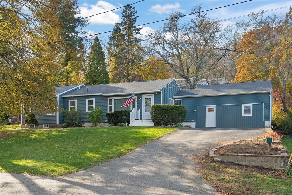 21 Francis Avenue Groveland, MA 01834 - Photo 1 of 29 a front view of a house with a yard and garage