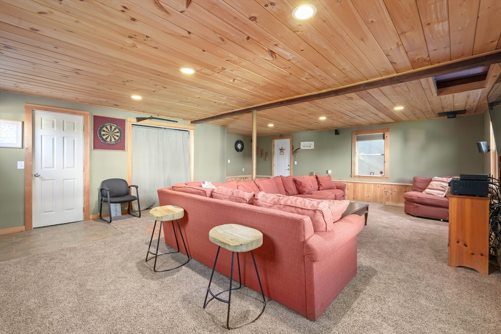 21 Francis Avenue Groveland, MA 01834 - Photo 11 of 29 a living room with furniture and a table