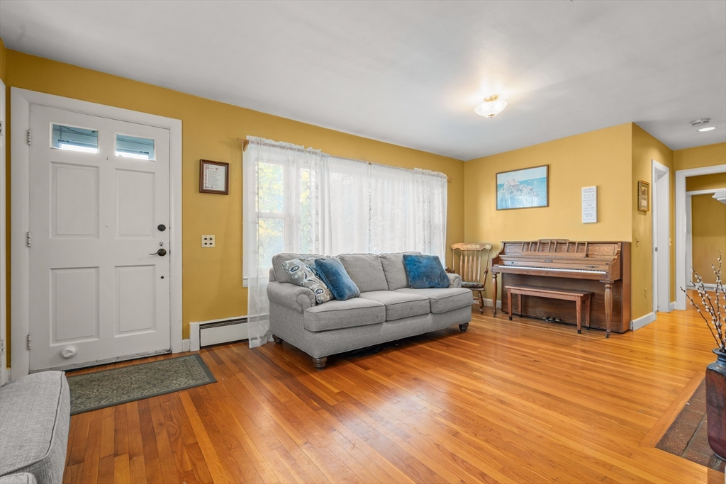 21 Francis Avenue Groveland, MA 01834 - Photo 16 of 29 a living room with furniture and a wooden floor