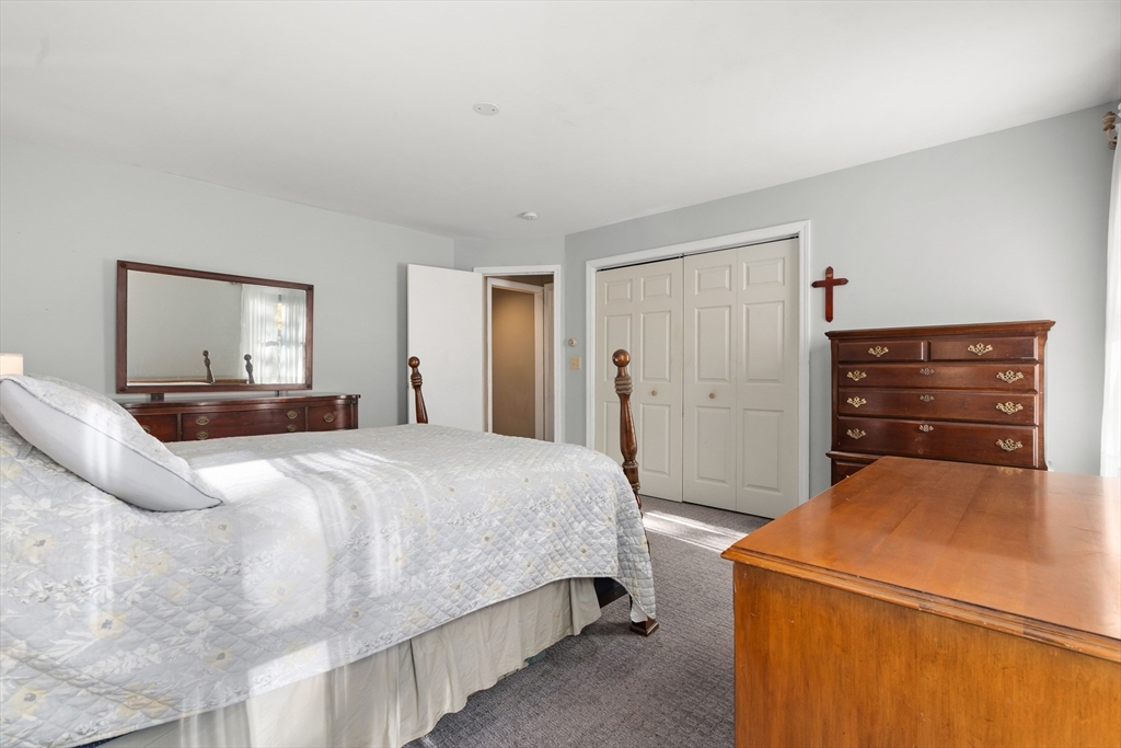 21 Francis Avenue Groveland, MA 01834 - Photo 17 of 29 a bedroom with a bed and a dresser