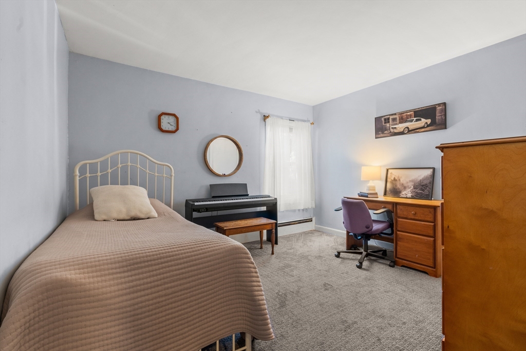 21 Francis Avenue Groveland, MA 01834 - Photo 19 of 29 a bedroom with a bed and a desk