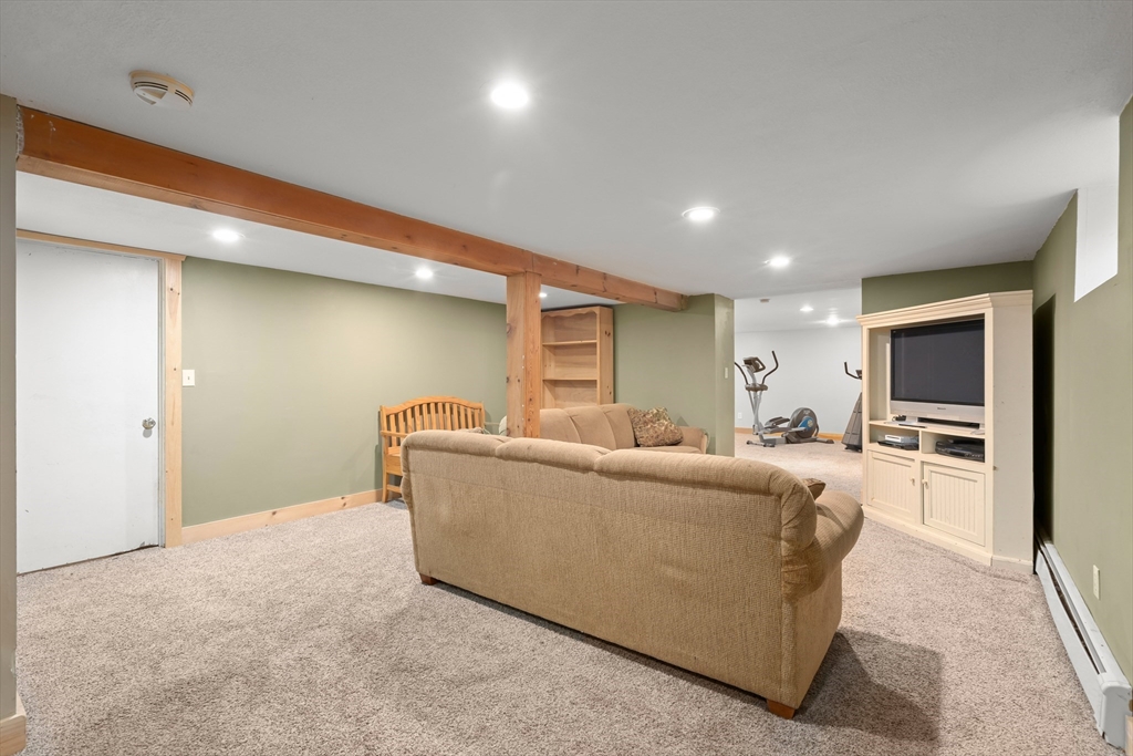 21 Francis Avenue Groveland, MA 01834 - Photo 24 of 29 a living room with furniture and a flat screen tv